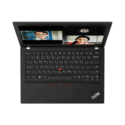 Top view of Lenovo ThinkPad X280 laptop with keyboard and screen displaying video calls.